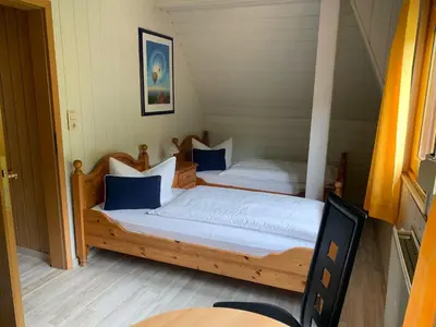 Ein Bett oder Betten in einem Zimmer der Unterkunft Bergcafé Mendorf