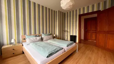 Ein Bett oder Betten in einem Zimmer der Unterkunft Ferienwohnung am Bodetal mit Wallbox für E-Auto