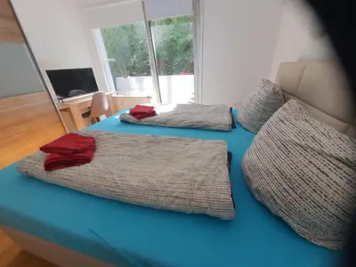 Ein Bett oder Betten in einem Zimmer der Unterkunft Happy Home - inclusive Pool & Sauna