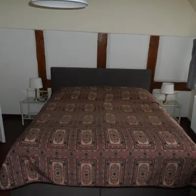 Ein Bett oder Betten in einem Zimmer der Unterkunft Altes Tagelöhnerhaus von 1510 mit Garten und Parkplatz