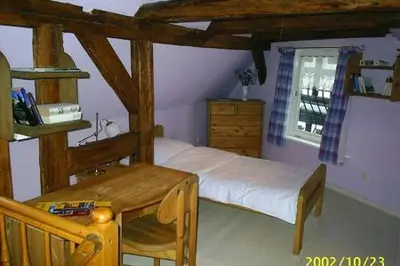 Ein Bett oder Betten in einem Zimmer der Unterkunft Altes Tagelöhnerhaus von 1510 mit Garten und Parkplatz