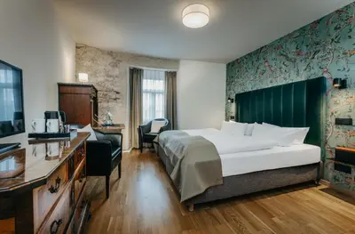 Ein Bett oder Betten in einem Zimmer der Unterkunft Romantik Hotel Alte Münze
