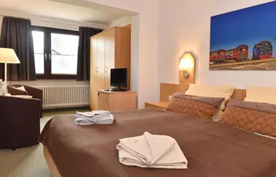 Ein Bett oder Betten in einem Zimmer der Unterkunft Pension - Der Berghof