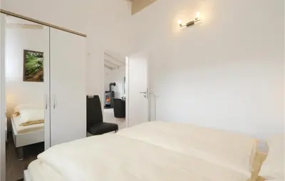 Ein Bett oder Betten in einem Zimmer der Unterkunft Ferienhausdorf Thale
