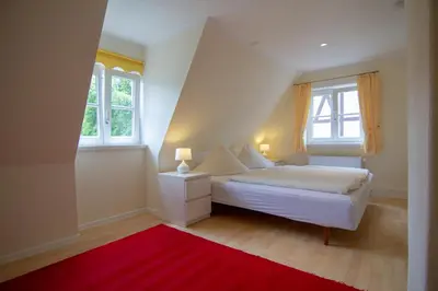 Ein Bett oder Betten in einem Zimmer der Unterkunft Gästehaus Schmitz