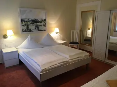 Ein Bett oder Betten in einem Zimmer der Unterkunft Gästehaus Schmitz