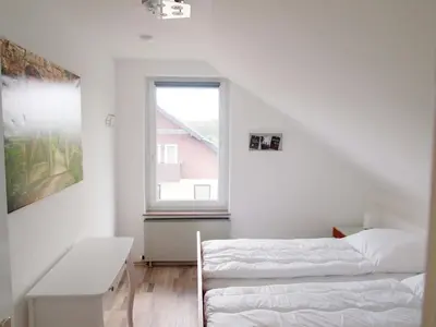 Ein Bett oder Betten in einem Zimmer der Unterkunft Ferienwohnung Schimmer 27