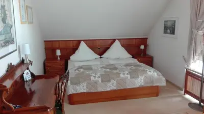 Ein Bett oder Betten in einem Zimmer der Unterkunft Ferienwohnung Kück-Rathausstrasse