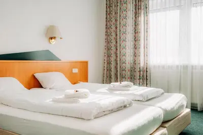 Ein Bett oder Betten in einem Zimmer der Unterkunft Hotel zur Radau