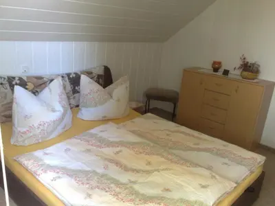 Ein Bett oder Betten in einem Zimmer der Unterkunft Ferienwohnungen Marianne Lau