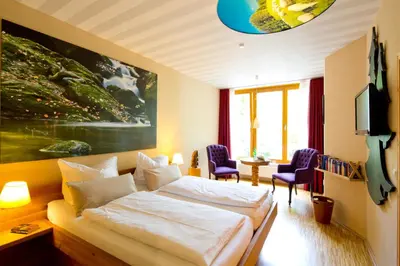 Ein Bett oder Betten in einem Zimmer der Unterkunft Plumbohms ECHT-HARZ-HOTEL