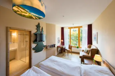 Ein Bett oder Betten in einem Zimmer der Unterkunft Plumbohms ECHT-HARZ-HOTEL