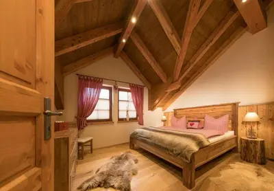 Ein Bett oder Betten in einem Zimmer der Unterkunft Chalets zum Ilsetal , Sport-Chalet