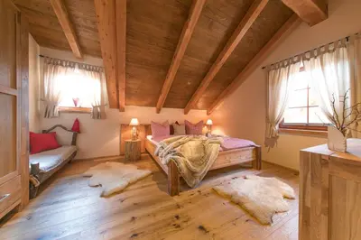 Ein Bett oder Betten in einem Zimmer der Unterkunft Chalets zum Ilsetal, Jagd-Chalet