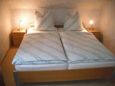 Ein Bett oder Betten in einem Zimmer der Unterkunft Ferienwohnung Windten