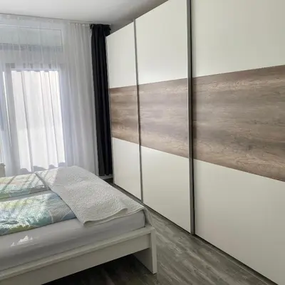 Ein Bett oder Betten in einem Zimmer der Unterkunft International