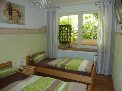 Ein Bett oder Betten in einem Zimmer der Unterkunft Ferienwohnung Kranich
