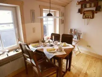Ein Sitzbereich in der Unterkunft Pension Picco-Bello