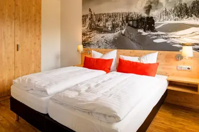 Ein Bett oder Betten in einem Zimmer der Unterkunft BSW Ferienwohnungen Brockenblick
