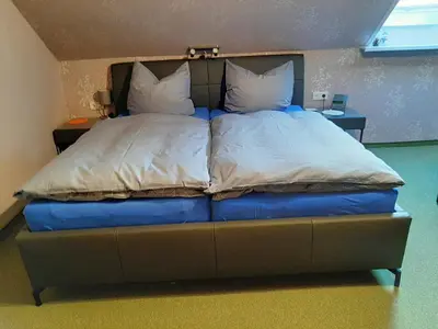 Ein Bett oder Betten in einem Zimmer der Unterkunft Ferienzimmer Wenzel