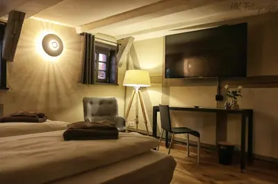Ein Bett oder Betten in einem Zimmer der Unterkunft Hotel Fairista Quedlinburg