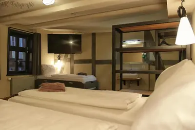 Ein Bett oder Betten in einem Zimmer der Unterkunft Hotel Fairista Quedlinburg