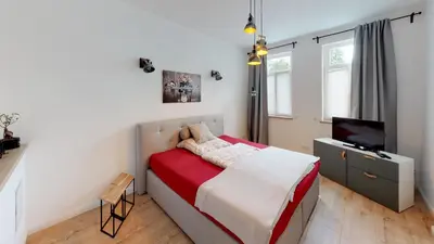 Ein Bett oder Betten in einem Zimmer der Unterkunft Ihr Zuhause am Jakobikirchhof