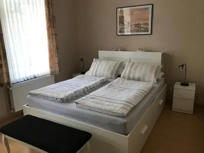 Ein Bett oder Betten in einem Zimmer der Unterkunft Ferienwohnung Bornemann