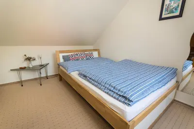Ein Bett oder Betten in einem Zimmer der Unterkunft Wernigerode - Die bunte Stadt am HARZ