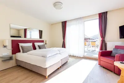 Ein Bett oder Betten in einem Zimmer der Unterkunft Mythenresort Heimdall