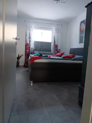 Ein Bett oder Betten in einem Zimmer der Unterkunft International 2