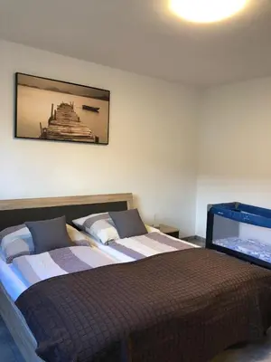Ein Bett oder Betten in einem Zimmer der Unterkunft International 2