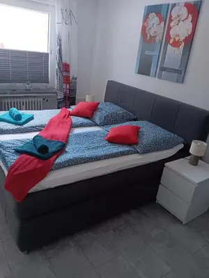 Ein Bett oder Betten in einem Zimmer der Unterkunft International 2