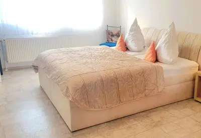 Ein Bett oder Betten in einem Zimmer der Unterkunft 4 Sterne Ferienwohnung 140 qm im Haus Tina