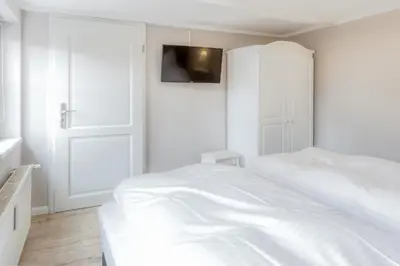 Ein Bett oder Betten in einem Zimmer der Unterkunft Ferienwohnungen Ziesing am Schlossberg