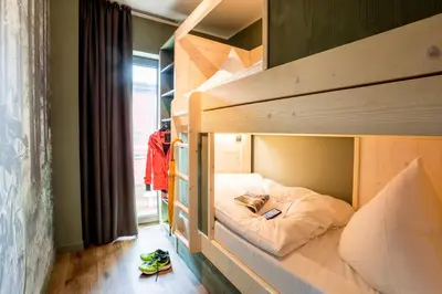 Ein Bett oder Betten in einem Zimmer der Unterkunft EchtZeit - Dein Hotelquartier