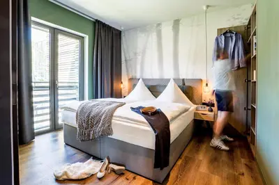 Ein Bett oder Betten in einem Zimmer der Unterkunft EchtZeit - Dein Hotelquartier