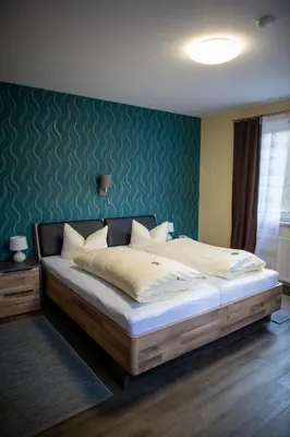 Ein Bett oder Betten in einem Zimmer der Unterkunft Sporthotel Wernigerode