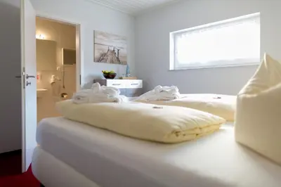 Ein Bett oder Betten in einem Zimmer der Unterkunft Sporthotel Wernigerode