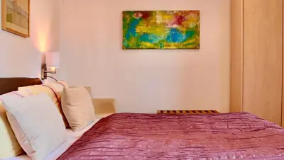 Ein Bett oder Betten in einem Zimmer der Unterkunft Pension Kurhausblick