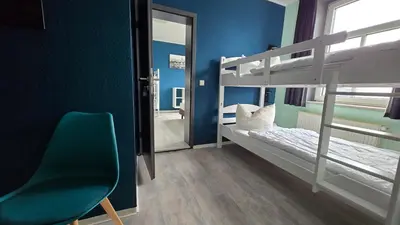 Ein Bett oder Betten in einem Zimmer der Unterkunft Harz Hostel