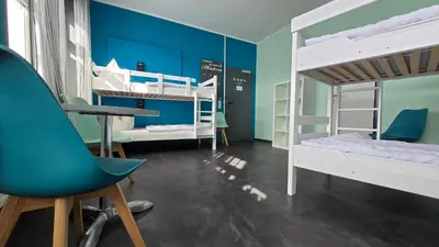 Ein Bett oder Betten in einem Zimmer der Unterkunft Harz Hostel