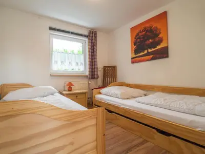 Ein Bett oder Betten in einem Zimmer der Unterkunft Naturferienhaus mit Schlossblick in Drübeck