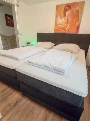Ein Bett oder Betten in einem Zimmer der Unterkunft Naturferienhaus mit Schlossblick in Drübeck