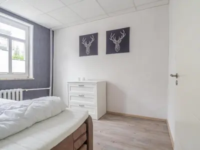 Ein Bett oder Betten in einem Zimmer der Unterkunft Ferienhaus Winde 8
