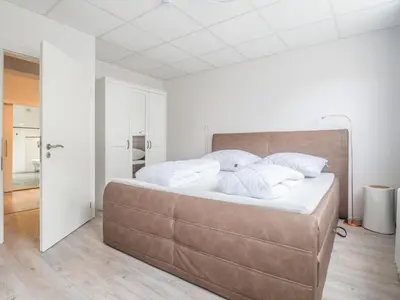Ein Bett oder Betten in einem Zimmer der Unterkunft Ferienhaus Winde 8