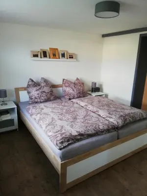 Ein Bett oder Betten in einem Zimmer der Unterkunft FeWo Königstein