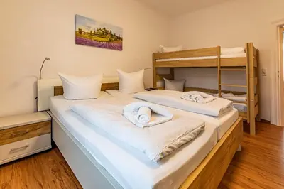 Ein Bett oder Betten in einem Zimmer der Unterkunft Ferienwohnung Margot
