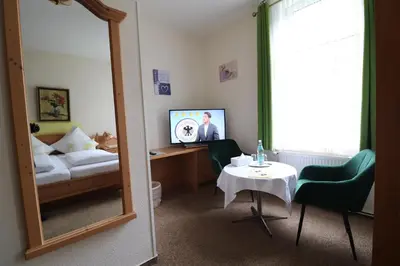 Ein Bett oder Betten in einem Zimmer der Unterkunft Hotel Weißes Roß