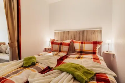 Ein Bett oder Betten in einem Zimmer der Unterkunft Hexe III